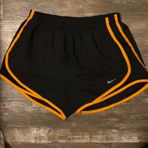 Small black and orange Nike shorts